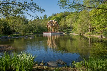 asian garden with pond and thai temple, westpark munichの写真素材