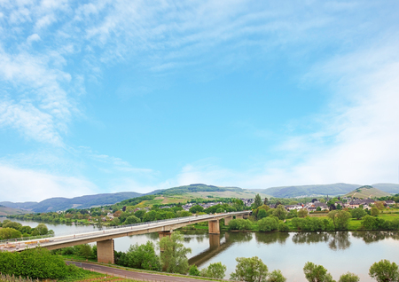 moselle river at springtime, blue sky background with clouds and copy space