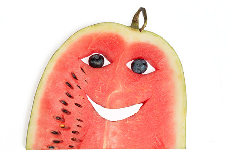 watermelon slice with carved funny faceの写真素材