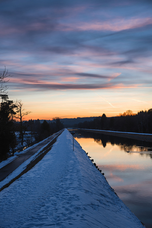 isar riverside walkway in winter at sunsetの写真素材
