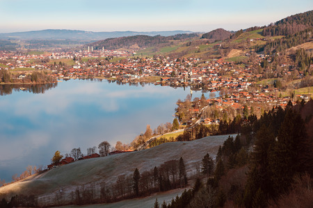 spa town schliersee at early springtime with frosty slope on a sunny morning