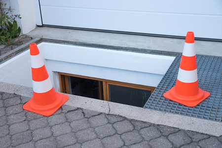 downfall warning with traffic cones. open well before the garage, new painted.