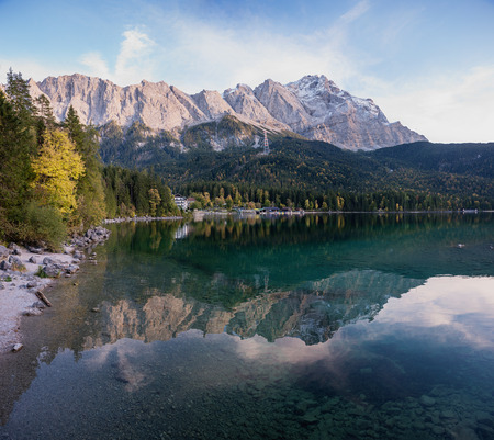 idyllic lake eibsee with zugspitze mass, reflecting in the water. beautiful tourist destination upper bavariaの写真素材