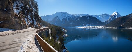 view from lakeside road to lake achensee and health resort Pertisau, winter landscape austria, tirolの写真素材