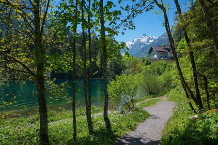 idyllic walkway from oberstdorf to lake Christlessee, allgau alps in spring. Tourist destination...