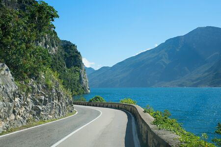 journey at Gardesana road at the west side of garda lake  italy. tourist area lombardyの写真素材