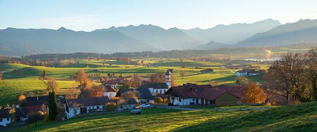 idyllic village aidling, rural bavarian landscape called Blaues Land, german autumnal sceneryの写真素材
