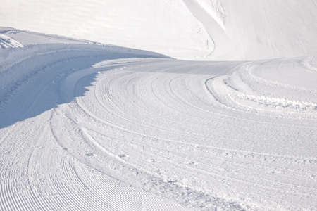 curvy ski slope in the alps, winter scenery austriaの写真素材