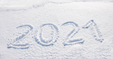 New year 2021, handwritten in snow, seasonal backgroundの写真素材