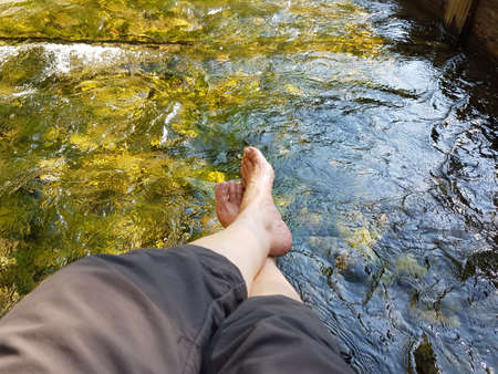 closeup of womans feet, hardening in a cold mountain brook, Kneipp cureの写真素材