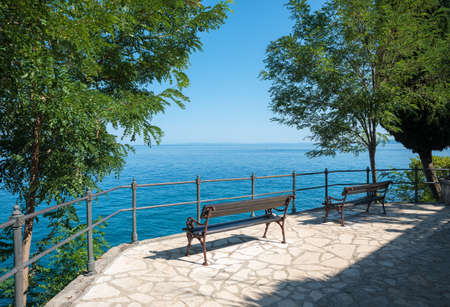 two benches at viewpoint, walkway along seaside adriatic coast, croatian landscape near Opatijaの写真素材