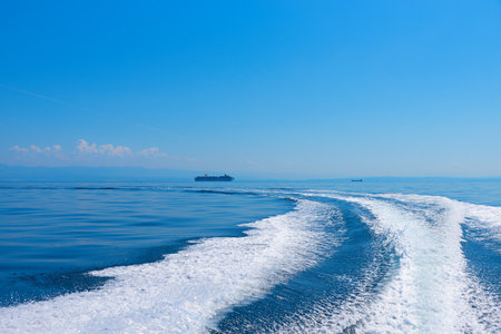 bow wave of a ship, blue adriatic ocean, Kvarner Bay Croatiaの写真素材