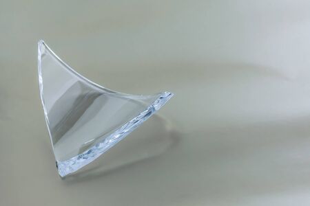Broken glass dish on white background. Part of home decoration that was damaged during washing.の写真素材