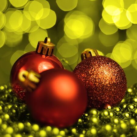 Christmas ornaments lying on balls of a Christmas chain on a blurred background with lights.の写真素材