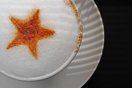 Close up of coffee cup with ornament made of cinnamonの写真素材