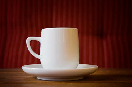 Close up of white coffee cup on the table