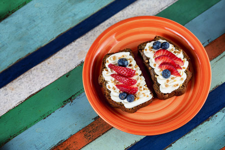 Healthy banana bread and fruit. Colorful breakfast.の写真素材