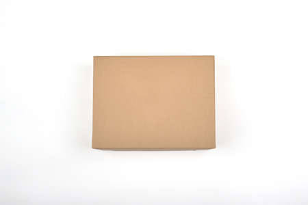 Studio shot of a paper box. Brown box on a white background. Packaging concept. Cardboard box.