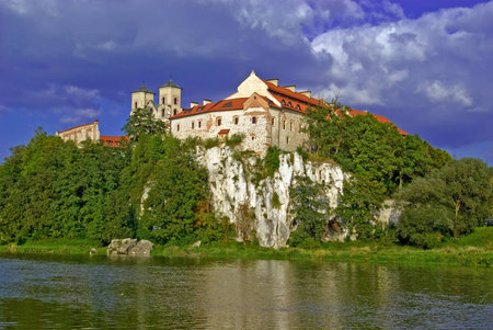 Benedictine Abbey on the rocky hill by the Vistula river in Tyniec against a blue skyのeditorial素材