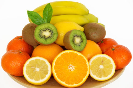 Juicy fresh fruit on a plate  Isolated on a white の写真素材