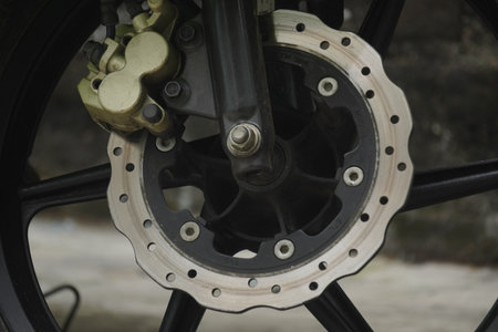 Motorcycle wheel with chain and disc brake. Close-up.の写真素材