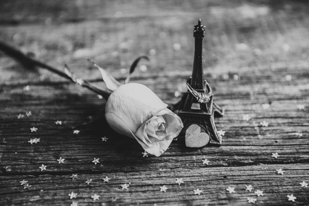 Declaration of love, the rose with a ring on a wooden board. Black and white photoの写真素材