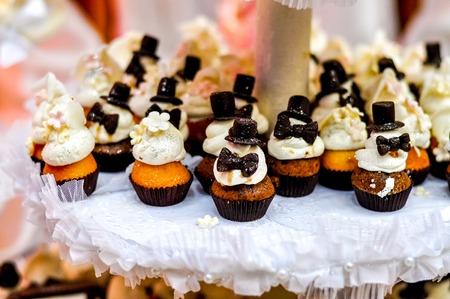 Wedding party cupcakes. View of bride and groomの写真素材