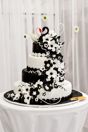 Wedding cake decorated with fondant. Decorated chocolate flowersの写真素材