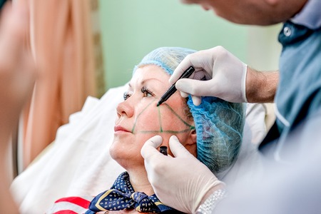Senior woman getting skin care injection. Senior woman getting skin care injectionの写真素材