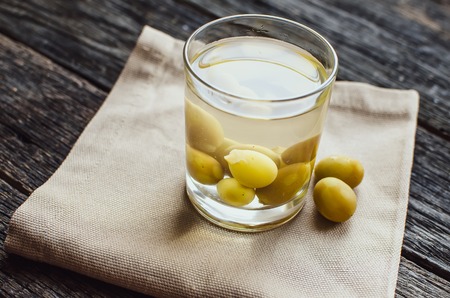 compote of grapes in a glass worth on a wooden tableの写真素材