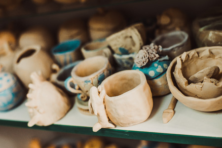 child work, ceramics stands on a shelf and dryの写真素材