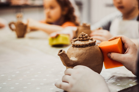 children's hands sculpts clay crafts pottery schoolの写真素材