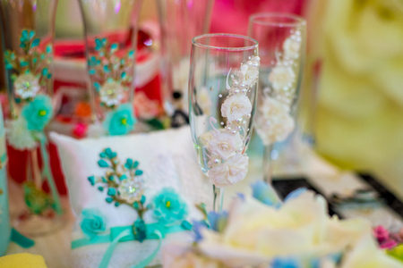 Beautiful wedding glasses are on the table.の写真素材