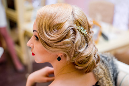 blondika beautiful girl in a wedding dressing gown with an evening make-up and hairstyle.   face Profileの写真素材