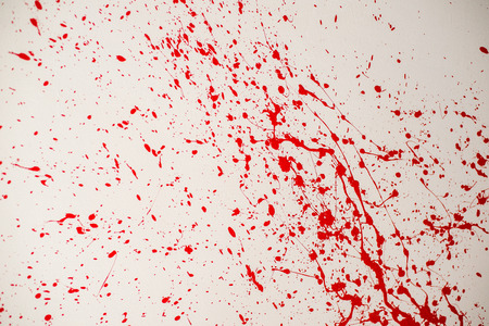 Blood splatter, red acrylic paint splash isolated on wall background texture grunge. Blood splash, spray. Abstract blood decoration. Murder and killing. Close up.の写真素材