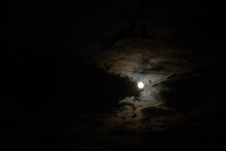 Night sky and a full moon in the clouds. Night sky and a full moon in the cloudsの写真素材