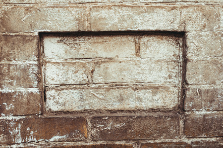 Weathered texture of stained old dark brown and red brick wall background, grungy rusty blocks of stone-work technology, colorful horizontal architectureの写真素材