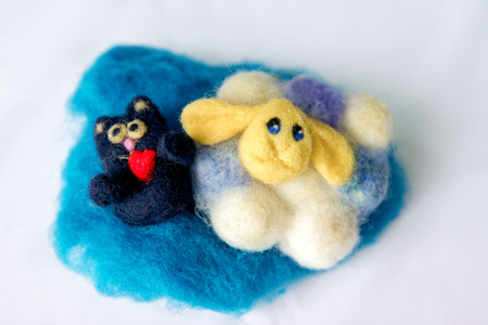 Felting wool, wool products. Cat and sheepの写真素材