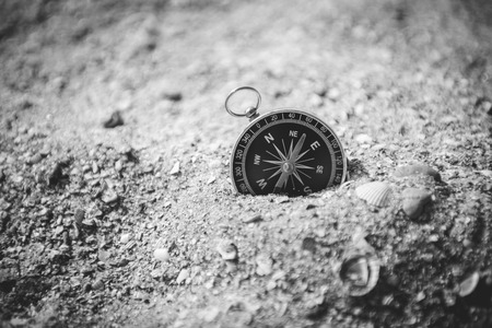 compass on the sea sand and place for text. compass on the groundの写真素材