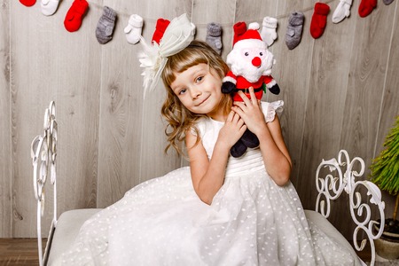 Christmas. child fell asleep near the Christmas tree waiting for Santa Clausの写真素材