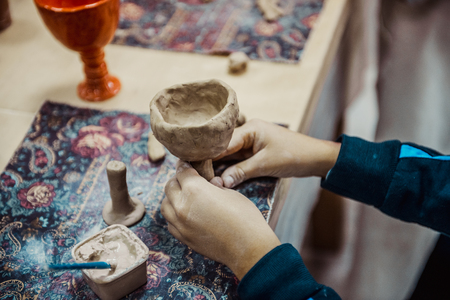 children's hands sculpts clay crafts pottery schoolの写真素材