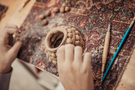 children's hands sculpts clay crafts pottery schoolの写真素材