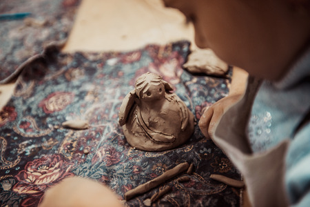 children's hands sculpts clay crafts pottery schoolの写真素材