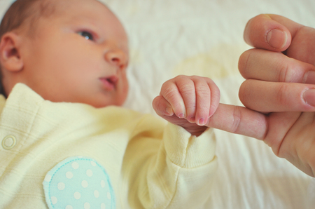father holding newborn baby on the handleの写真素材