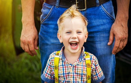 Portrait of smiling happy baby boy with a mohawkの写真素材