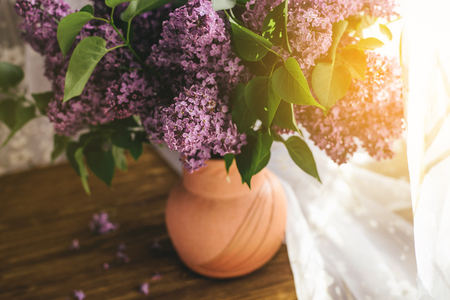 Bright lilac. A bouquet of purple lilacs in a vase near the window. Lilac in a vase. Place for text. Soft focus.の写真素材