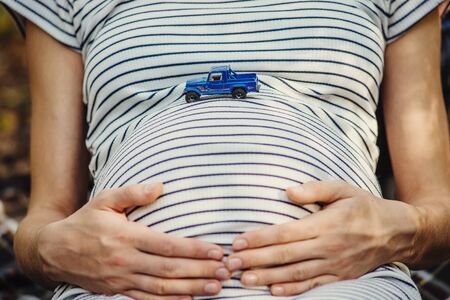 pregnant woman with toy machineの写真素材