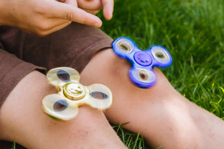 Two spinner in the child's handsの写真素材