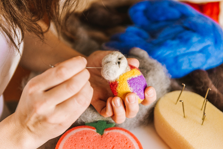 Manufacturing process from wool soft toys. Felting activityの写真素材