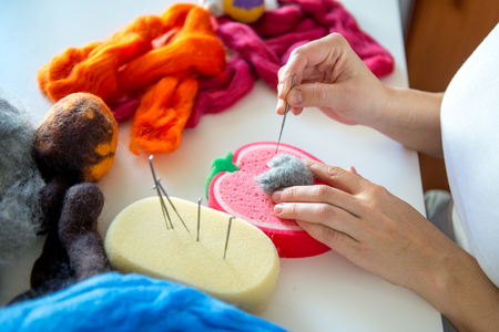 Manufacturing process from wool soft toys. Felting activityの写真素材